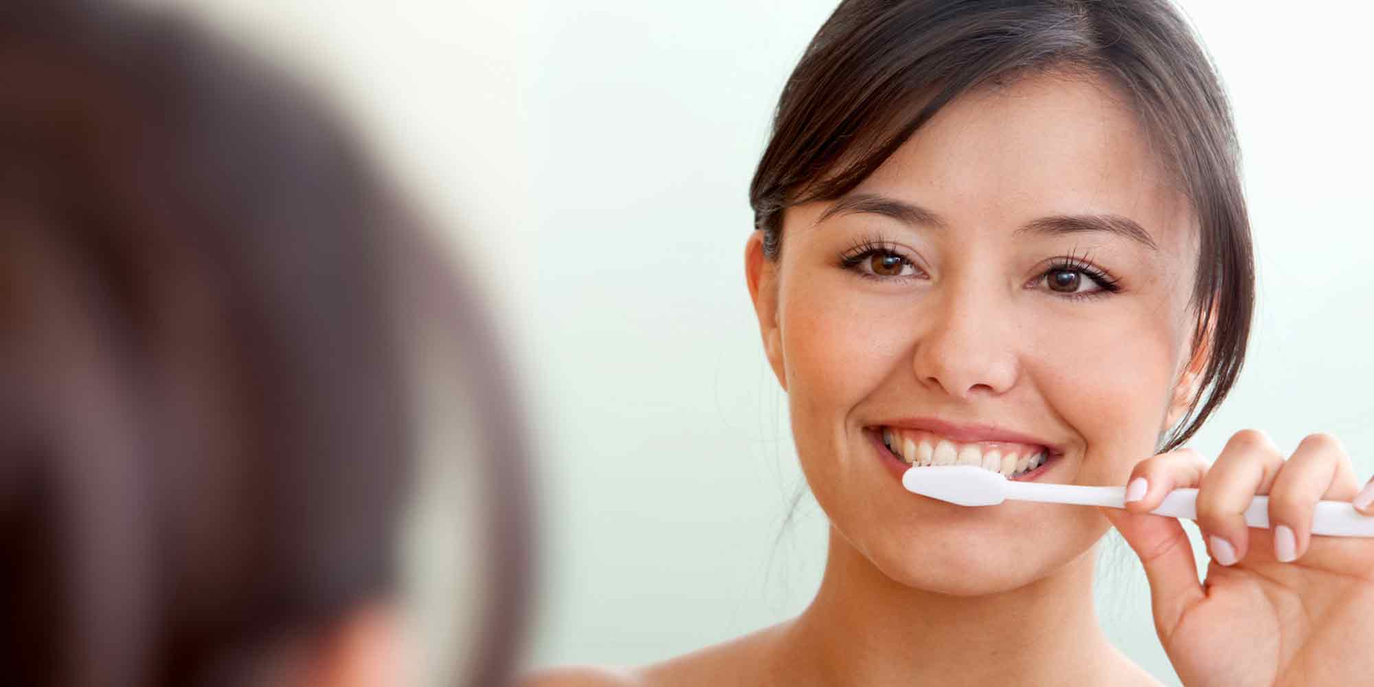 Dentist Waukesha WI Hillcrest Family Dental Woman Brushing Teeth