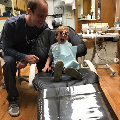 Dentist Waukesha WI Ross Oberschlake With A Happy Child