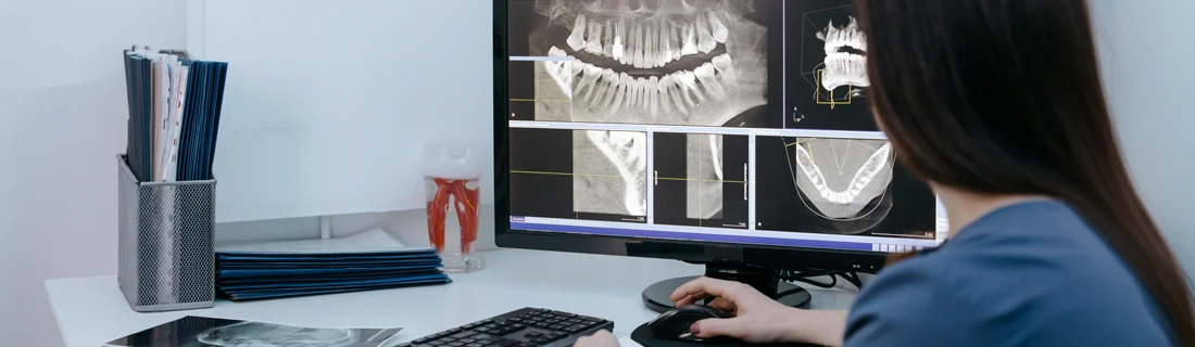 Technician Analyzing X-Rays